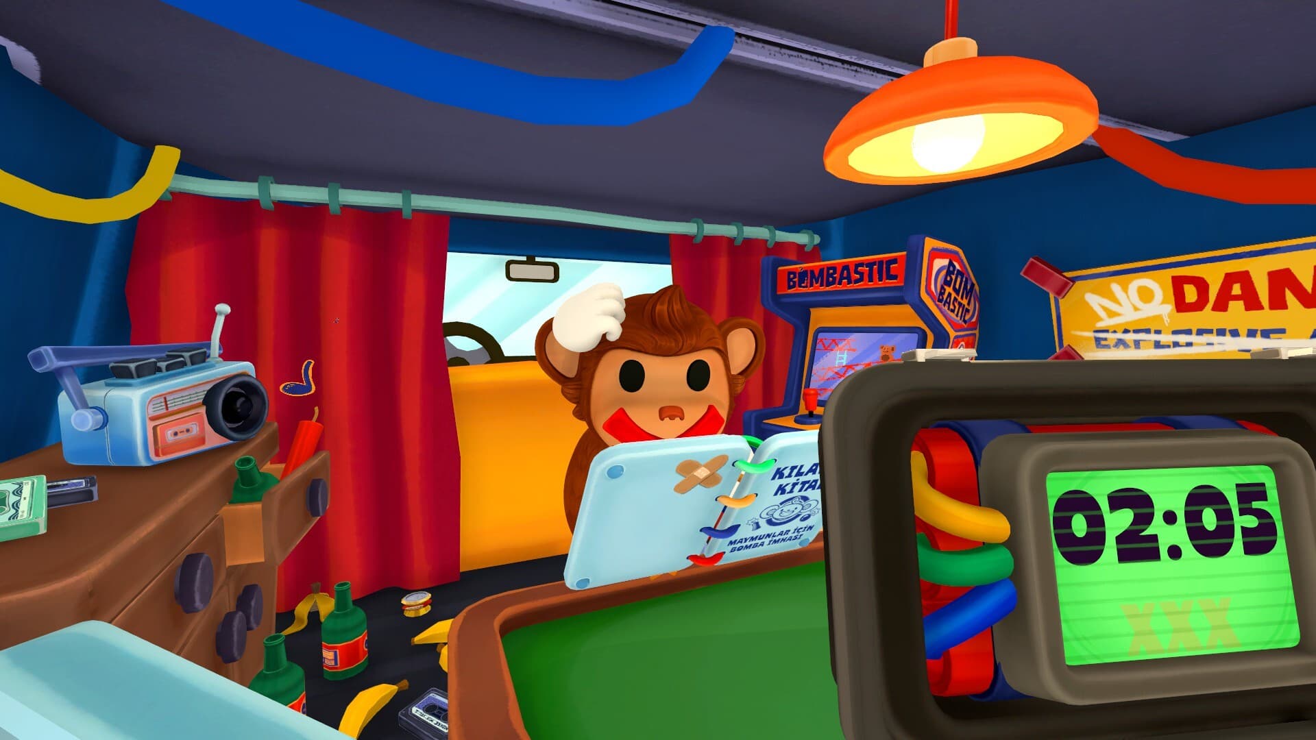 Inside the minivan: curtains, a radio, an arcade cabinet and the bomb with its timer reading 02:05.